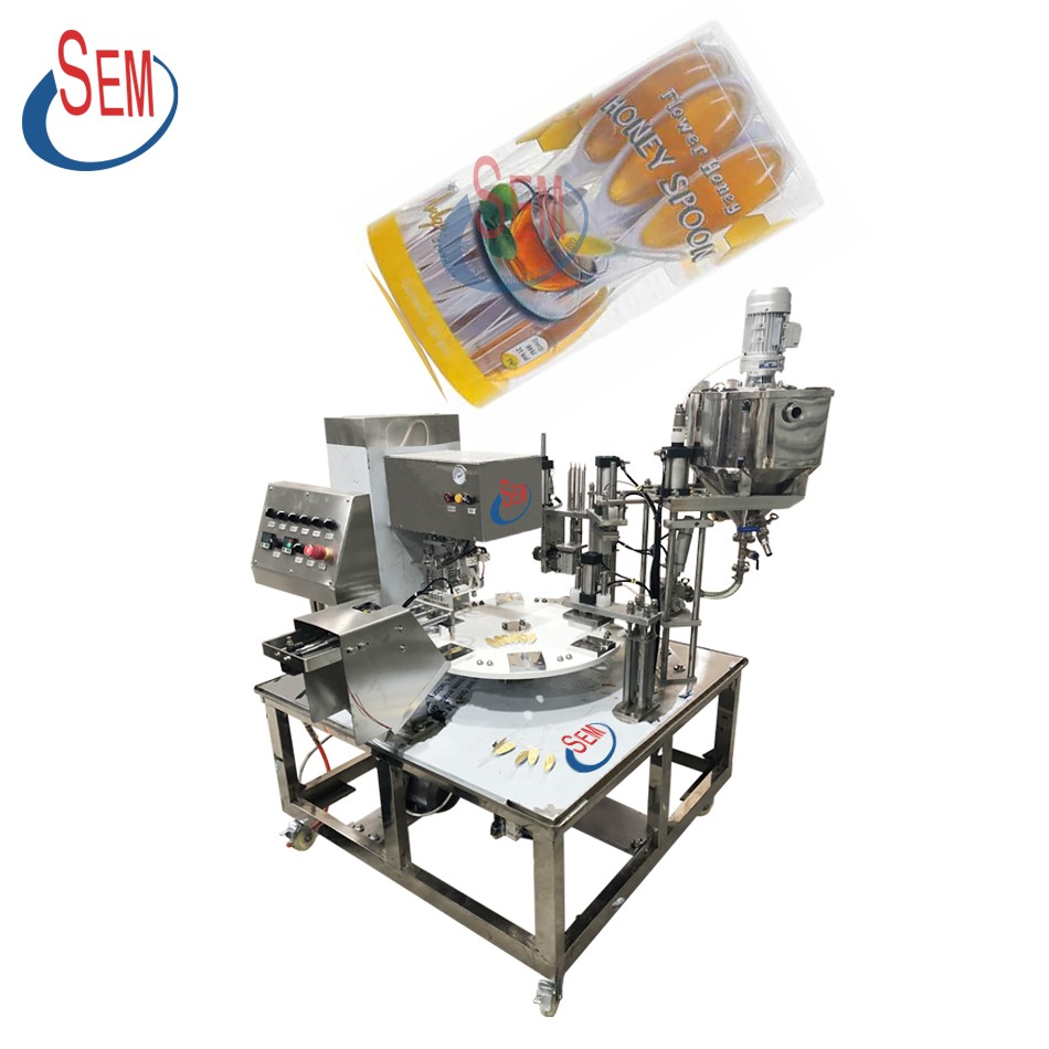 Honey spoon filling and sealing machine