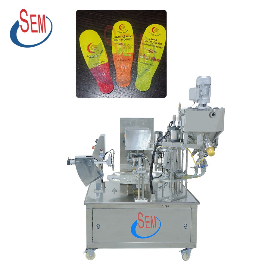 Honey spoon filling and sealing machine